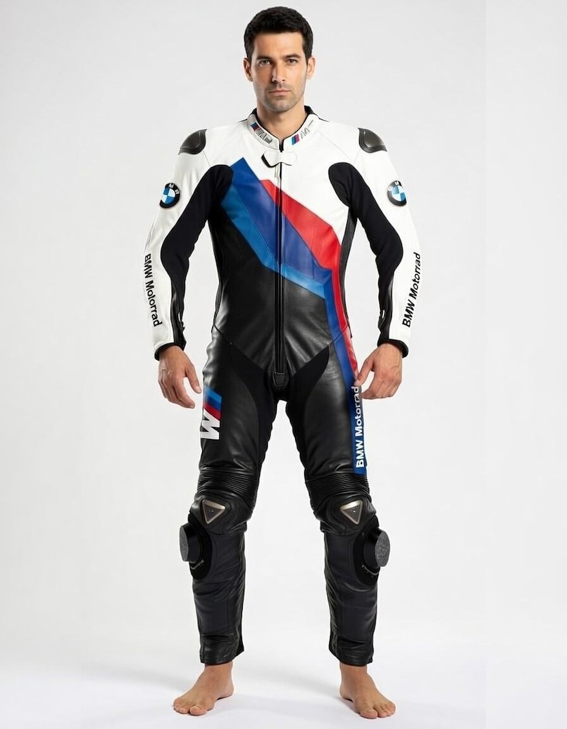 May include: A black, white, and blue leather motorcycle racing suit. The suit features the BMW Motorrad logo and a color block design with red and blue stripes. The suit has protective padding on the shoulders and knees.