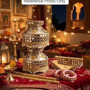 May include: A decorative silver-toned pot adorned with circular mirrors, gold embroidery, and white beaded fringe. The set includes a matching rectangular tray with mirror accents and two pink and gold striped bangles, all featuring the text Reference Photo Only.