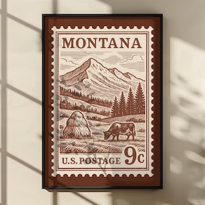May include: Framed print of a vintage Montana postage stamp design. The sepia-toned artwork features a mountain range, trees, a cow grazing, and a haystack. The text reads "MONTANA" and "U.S. POSTAGE 9c". The frame is dark brown.