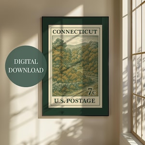 May include: A framed vintage Connecticut U.S. postage stamp print. The artwork depicts a scenic landscape with trees, a stone wall, and a winding road. The stamp is green, beige, and brown, with the text "CONNECTICUT" and "U.S. POSTAGE".