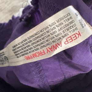 Pantaloni da jogging da donna Free People FP Movement, taglia media, colore ametista scuro, modello Wayside, NUOVI immagine 11