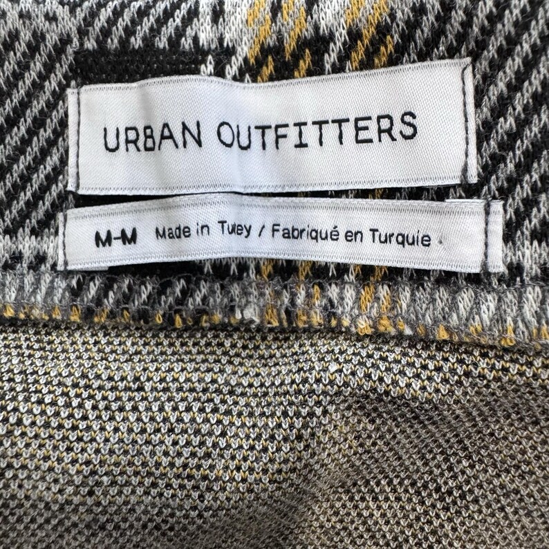 Minifalda a cuadros de Urban Outfitters, amarilla, negra y gris, con fruncido y nudo frontal, talla M para mujer. imagen 8