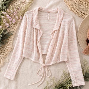 Cárdigan de punto estilo boho, color rosa marfil, abierto por delante, de Free People, talla XS. imagen 1