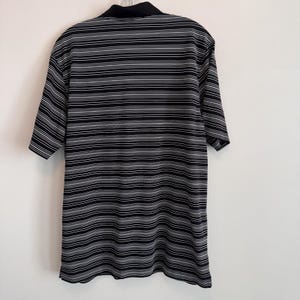 Polo Nike Golf Dri Fit para hombre, talla L, negro, blanco, rayas Swoosh. imagen 2