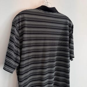 Polo Nike Golf Dri Fit para hombre, talla L, negro, blanco, rayas Swoosh. imagen 9