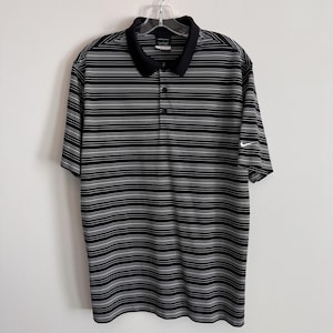 Polo Nike Golf Dri Fit para hombre, talla L, negro, blanco, rayas Swoosh. imagen 1