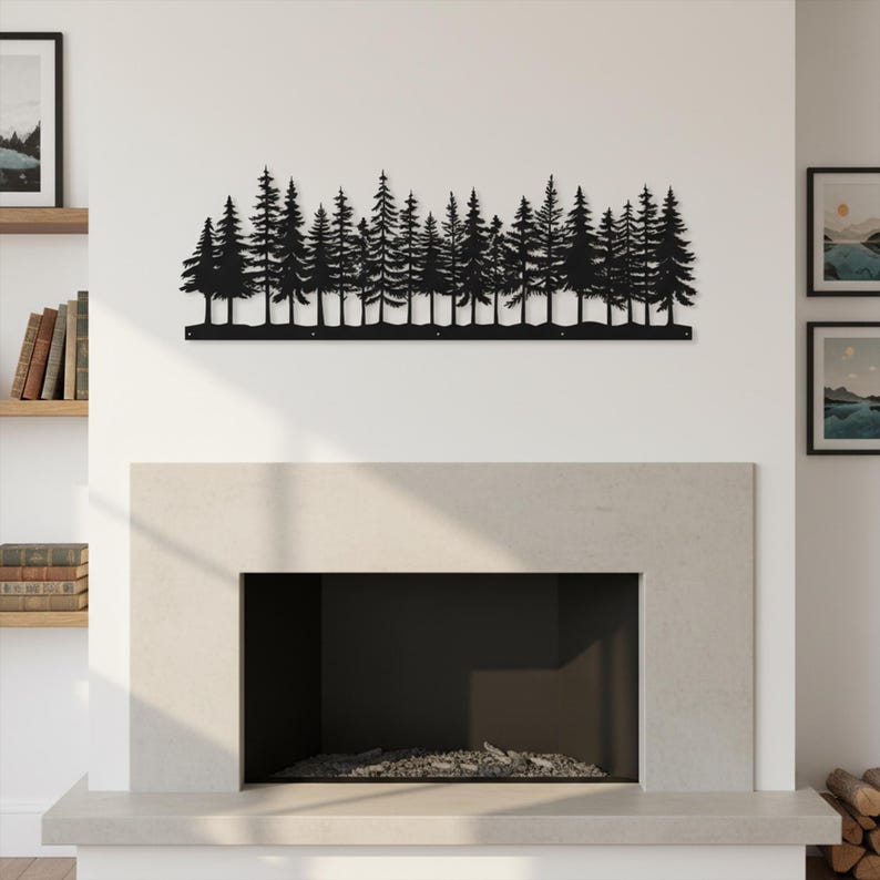 May include: A black metal wall art piece depicting a forest of pine trees. The silhouette of the trees is mounted on a white wall above a fireplace. The artwork is a long, horizontal design.