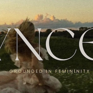 May include: A picturesque scene with the word "SYNCED" in large, elegant letters. Below, the phrase "GROUNDED IN FEMININITY" is written in a smaller font. The background features a person in a field at sunset.