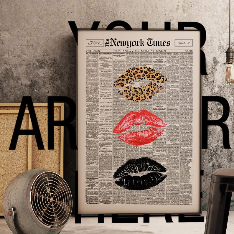 May include: A framed print featuring three sets of lips in leopard print, red, and black, set against a vintage newspaper background. The print is titled "The New York Times" and dated June 21.