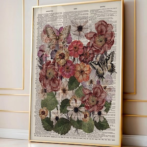 May include: A framed botanical print featuring a collage of flowers and butterflies. The artwork is set against a backdrop of vintage dictionary pages, with a gold frame. The flowers are in shades of red, pink, and orange.