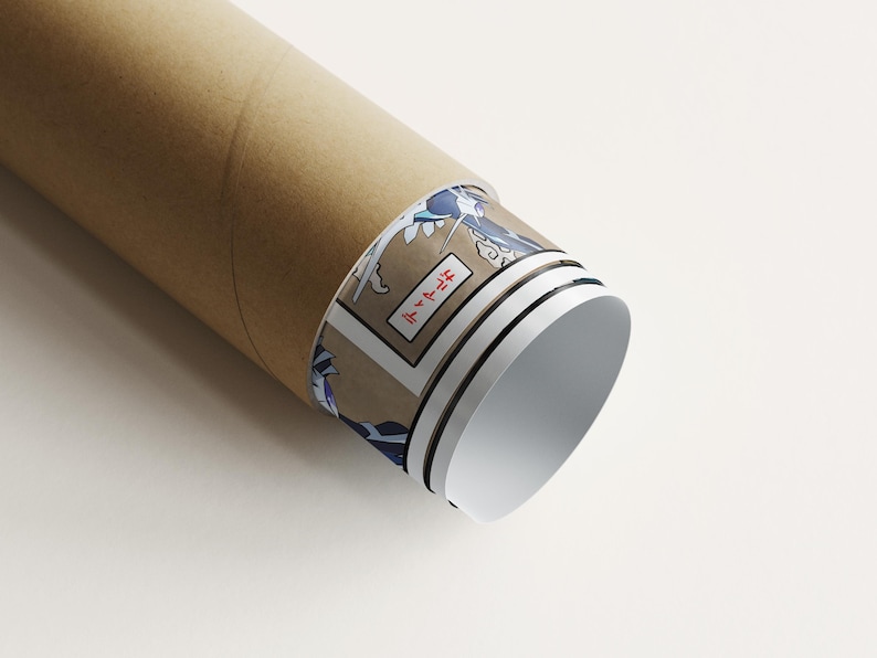 May include: A rolled-up poster in a brown cardboard tube. The poster's edge reveals a Japanese-style illustration with blue waves and text in a rectangular frame. The tube is on a white surface.