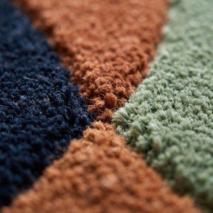 Retro Geometric Rug Texture Close Up - Navy Terracotta Amber Sage Wool Colours - Deep Texture Carpet - Hand Tufted Wool Rug Quality Detail