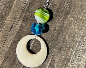 Handmade upcycled necklace is OOAK with blue, green and ivory beads on silver chain