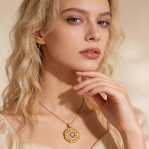 Handmade 18K gold plated octagon medallion pendant necklace featuring micro pave zircon sunburst center design. Eight-sided filigree frame with scrollwork patterns and small stone accents in each section. Teardrop bail with single zircon center. Twisted rope chain, nickel-free copper alloy. 50cm length, 10g weight. Openwork reverse side. Lucky charm symbolizing positive energy.