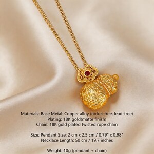 May include: Gold-colored necklace featuring a pendant with a gourd design and a red accent. The necklace has a twisted rope chain and a pendant size of 0.79" x 0.98". The necklace length is 19.7 inches.