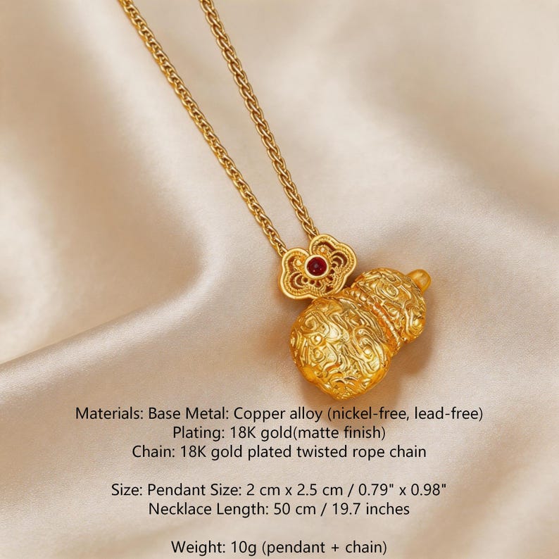 May include: Gold-colored necklace featuring a pendant with a gourd design and a red accent. The necklace has a twisted rope chain and a pendant size of 0.79" x 0.98". The necklace length is 19.7 inches.