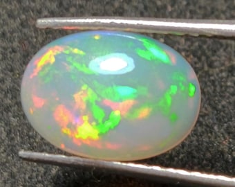 AAA+ Ethiopian Opal Cabochon, 11.4x8.3mm Oval Rainbow Gemstone