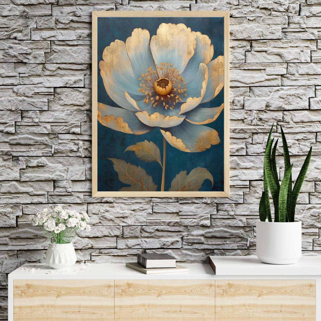 Blue & Gold Peony Wall Art: a large stylized flower with light blue petals, gold accents and a gold center on a dark teal background, in a wooden frame.