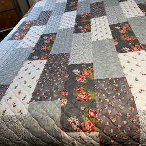 May include: A rustic wooden sign with the text "Welcome to our home" in white lettering. The sign features a distressed finish and a simple, inviting design, perfect for entryway decor.