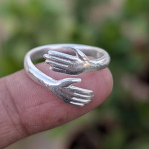 Sterling Silver Hug Ring – Embrace Hands Ring