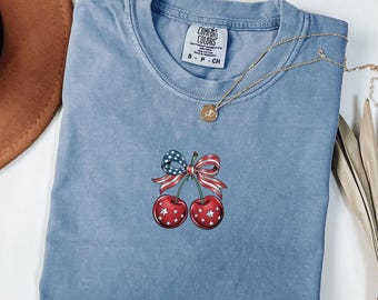 Comfort Colors® 4th of July Shirt, Coquette American Flag Shirt, USA Bow Shirt, USA Cherry Shirt, Women Patriotic Shirt, Red White and Blue