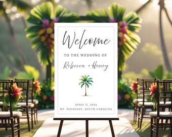 May include: A white wedding welcome sign on a black easel. The sign reads "Welcome" above "To the wedding of Rebecca + Henry" and includes a palm tree graphic. The date April 11, 2026, and location Mt. Pleasant, South Carolina are also displayed.