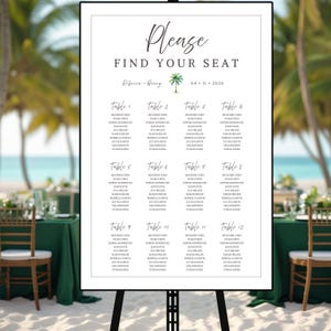 May include: A white wedding seating chart on an easel, with the words "Please Find Your Seat" in elegant script. The chart lists guest names under table numbers, with a palm tree graphic and the date 04-11-2026.