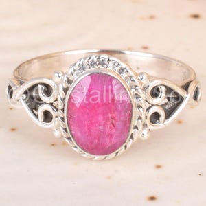 May include: A set of three ceramic mugs with a speckled, matte finish in cream, light grey, and dark grey. Each mug has a simple, minimalist design and a rounded handle.