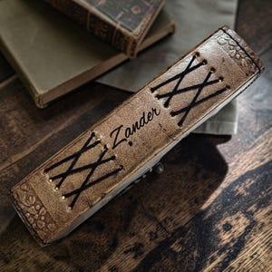 Custom name engraved on leather journal personalization example double dragon design