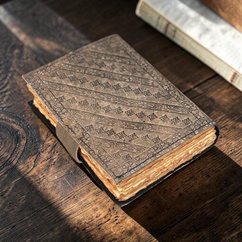 Rear perspective double dragon leather journal showing spine and back cover