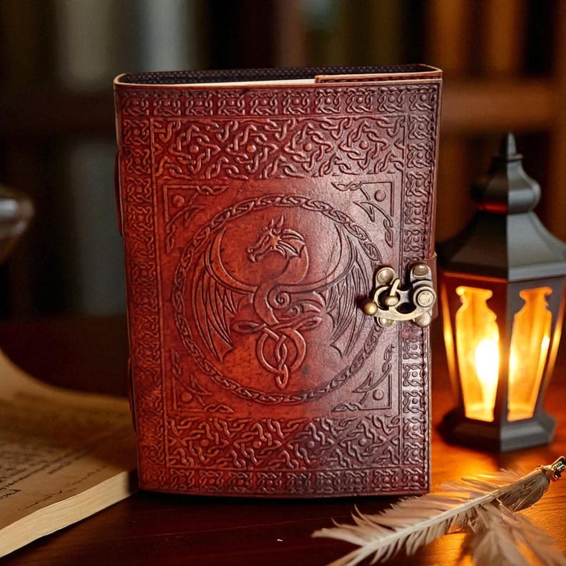 "Rustic red leather journal with dragon symbol cover"
