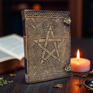 "Rustic handmade leather journal with witchcraft symbol"