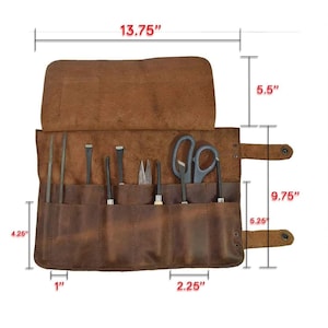 May include: A brown leather tool roll with various tools, including scissors, chisels, and files. The roll measures 13.75 inches wide and 9.75 inches tall when open. The tools are held in individual pockets.