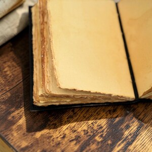 Handmade deckle edge paper inside leather journal rustic antique style pages detail