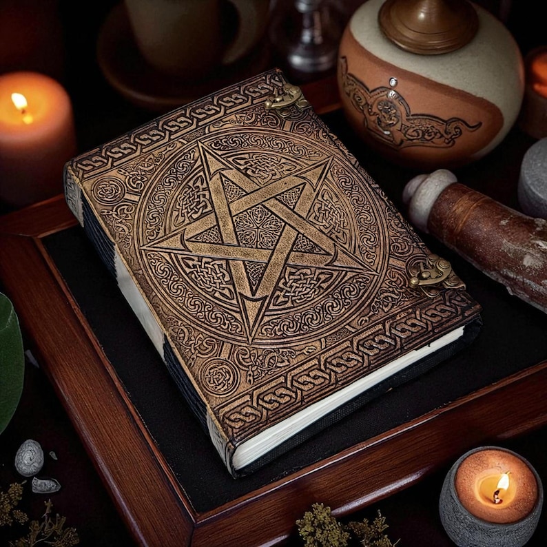 "Vintage leather grimoire journal with pagan star design"