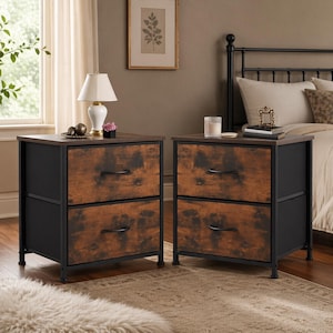 May include: Two matching nightstands with a rustic design. Each has a dark brown top, two drawers with a distressed wood appearance, and a black metal frame. The nightstands are placed on a patterned rug, with a bed and window in the background.
