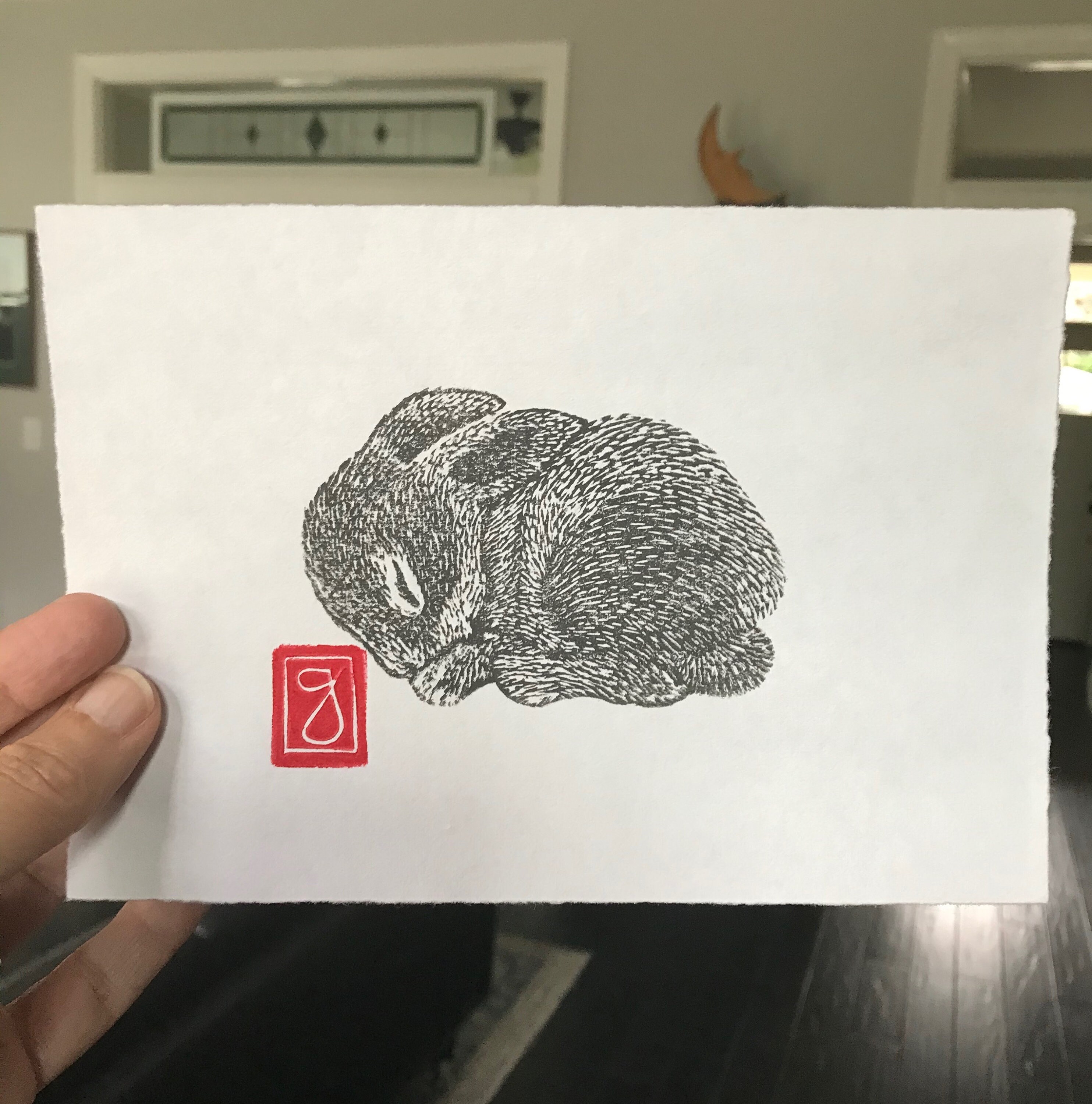 Printing a sleeping squirrel by hand using a ceramic baren I made