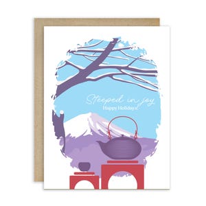May include: A holiday greeting card featuring a Japanese tea set illustration. The card has a purple teapot with a red handle, a teacup, and the text "Steeped in joy Happy Holidays!" against a snowy mountain and blue sky background.