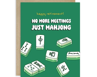 May include: A green greeting card with the text "happy retirement! NO MORE MEETINGS JUST MAHJONG." The card features illustrations of Mahjong tiles. The card has a brown envelope.