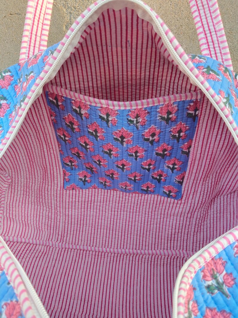 Cotton Quilted Duffle Bag Blue With Pink Floral Pattern, Indian Cotton Quilted Tote Bag Floral Print, Cotton Duffle Bag Large, Duffle Bags Handmade Travel Vintage, Hand Block Grocery shopping for women Jola Bags Carry Bags Shoulder, Market Daily Use Shopping Duffle Bag Toiletry Bags, Hand Block Printed Duffle Bags, Ethnic Handbags Cotton Quilted Tote Bag, Lightweight Cotton Weekender Bag, Traditional Hand Block Printed Floral Design And Quilted Finish, Reusable Overnight Trips And Gifting