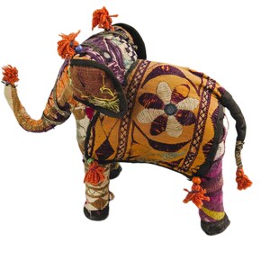 May include: A colorful, handmade fabric elephant toy with intricate embroidery and tassels. The elephant is decorated with orange, yellow, purple, and green fabric.