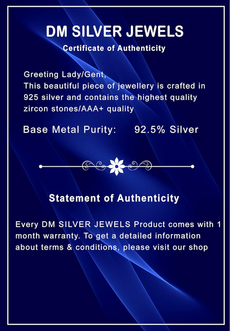 May include: A certificate from DM SILVER JEWELS, with a dark blue background and white text. The certificate states the jewellery is crafted in 925 silver with zircon stones. It also includes a statement of authenticity and warranty information.