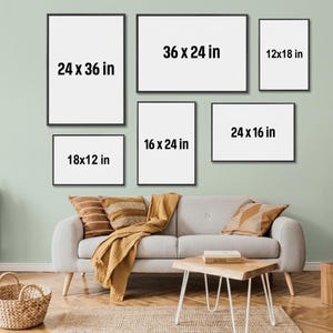 May include: Six rectangular frames with black borders arranged on a wall, displaying the dimensions 24x36 in, 36x24 in, 12x18 in, 18x12 in, 16x24 in, and 24x16 in. Below, a light gray sofa features a mustard yellow throw and two pillows.