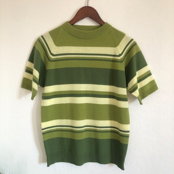 Green sweater shop with yellow stripe
