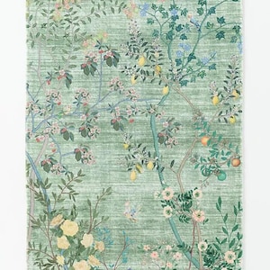 Alfombra tejida a mano de lana verde con diseño de jardín botánico, pájaros y flores.