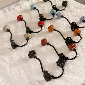 Antique Bronze Ceramic Hooks Hooks,Single wall hook, coat hook with metal frame & hand painted ceramic knobs.