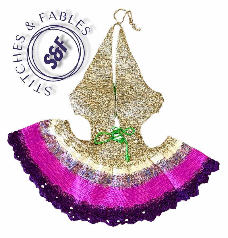 May include: A handmade crochet halter top and skirt set. The top is gold with a halter neck tie. The skirt features a vibrant gradient of colours, including purple, pink, and cream. The set is adorned with a green tie at the waist and a scalloped edge.