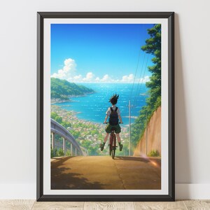 以下が含まれることがあります： フレーム入りアートプリント。アニメスタイルのイラストで、自転車に乗って丘を下り、海辺の町に向かう人物が描かれています。鮮やかな青い空、海、緑の丘が特徴です。