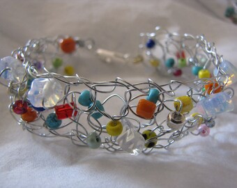 Crocheted wire bracelet multi-colored glass beads and semiprecious stones. Made to order.