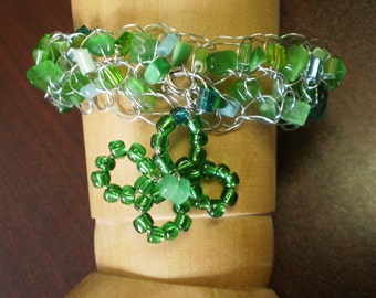 Kiss Me I'm Irish. Crocheted emerald green bracelet with shamrock charm.